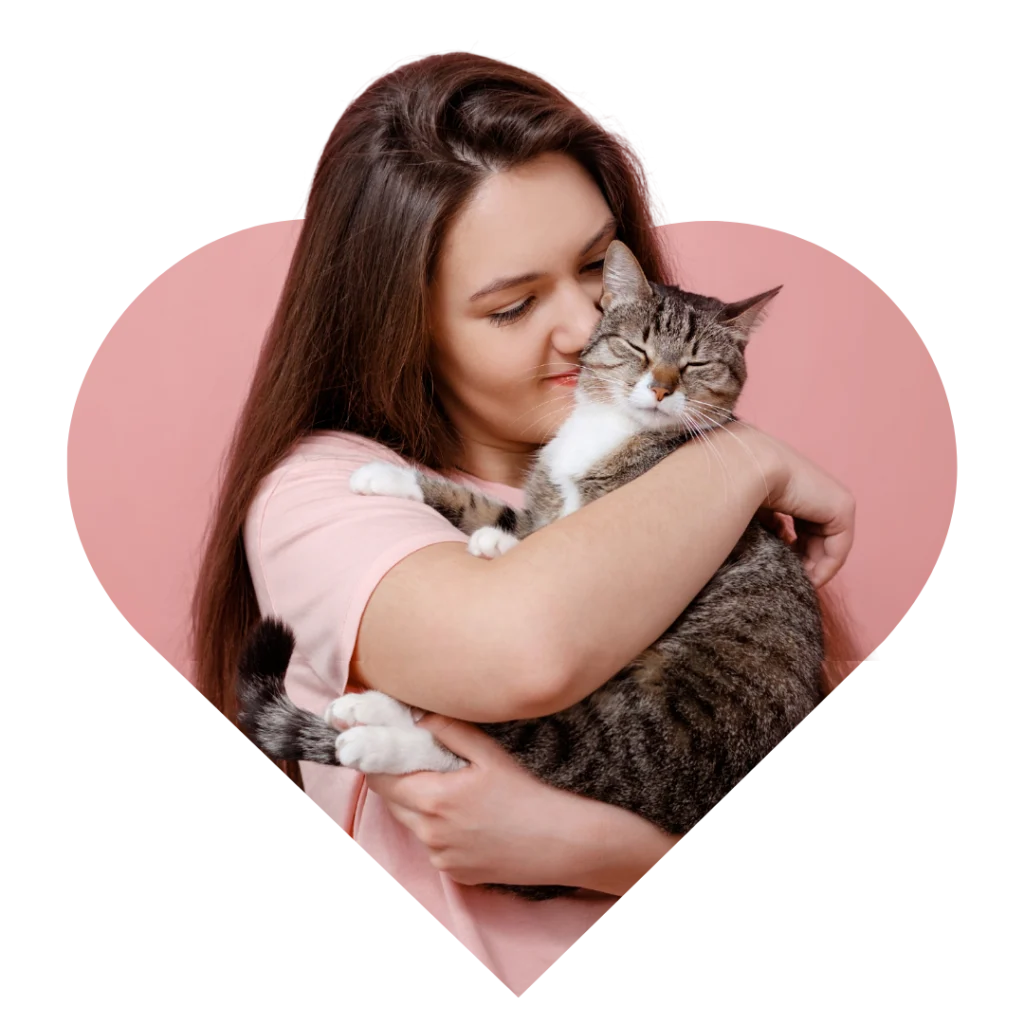 Woman hugging and kissing a cat – Heart N Paws love and comfort essentials, part of pet wellness and comfort essentials