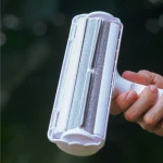 Compact pet hair remover with easy empty chamber