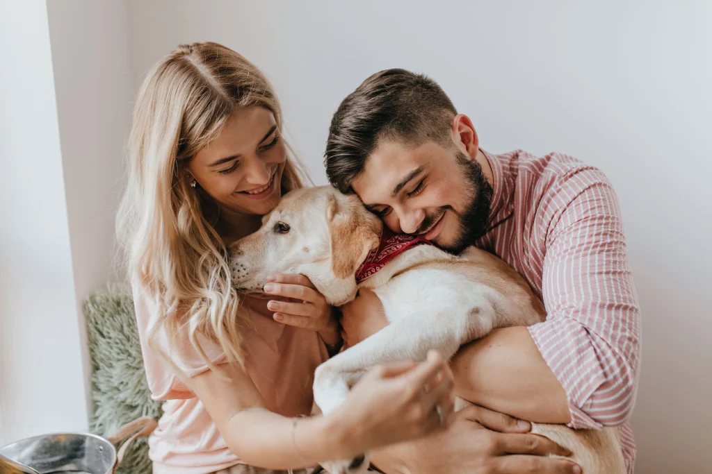 emotional side of pet parenting - Pet parent hugging dog
